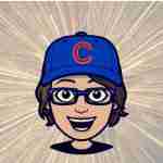 happy woman with glasses and Chicago cubs ball cap