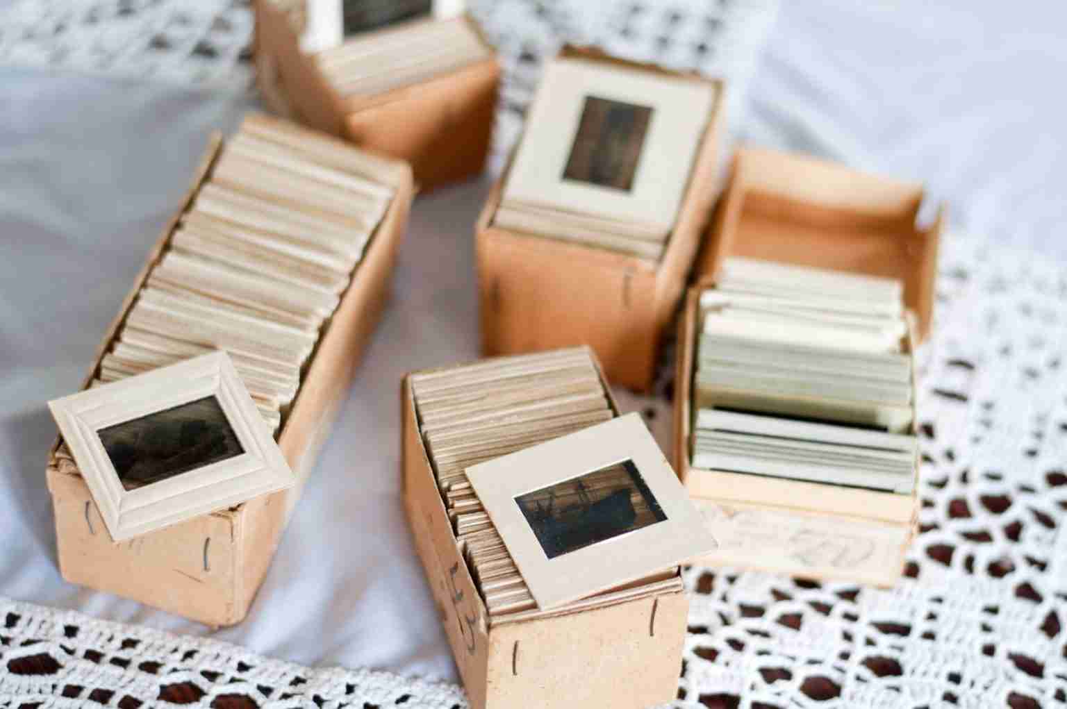 a group of boxes with photo slides waiting for good slide scanners