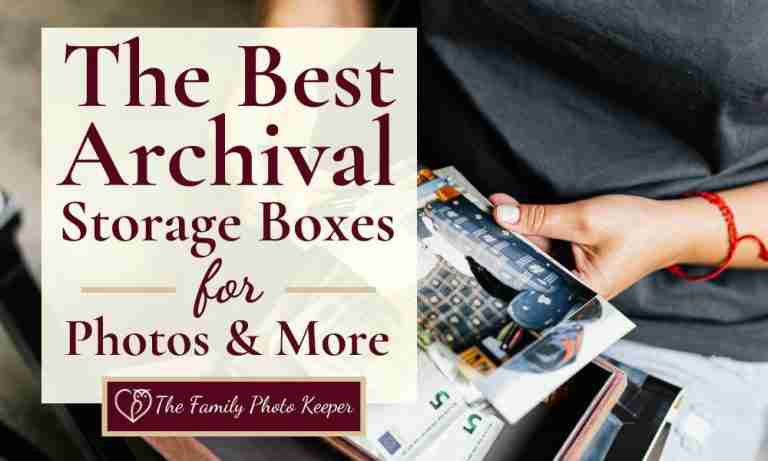 a hand holding a photo box with photos